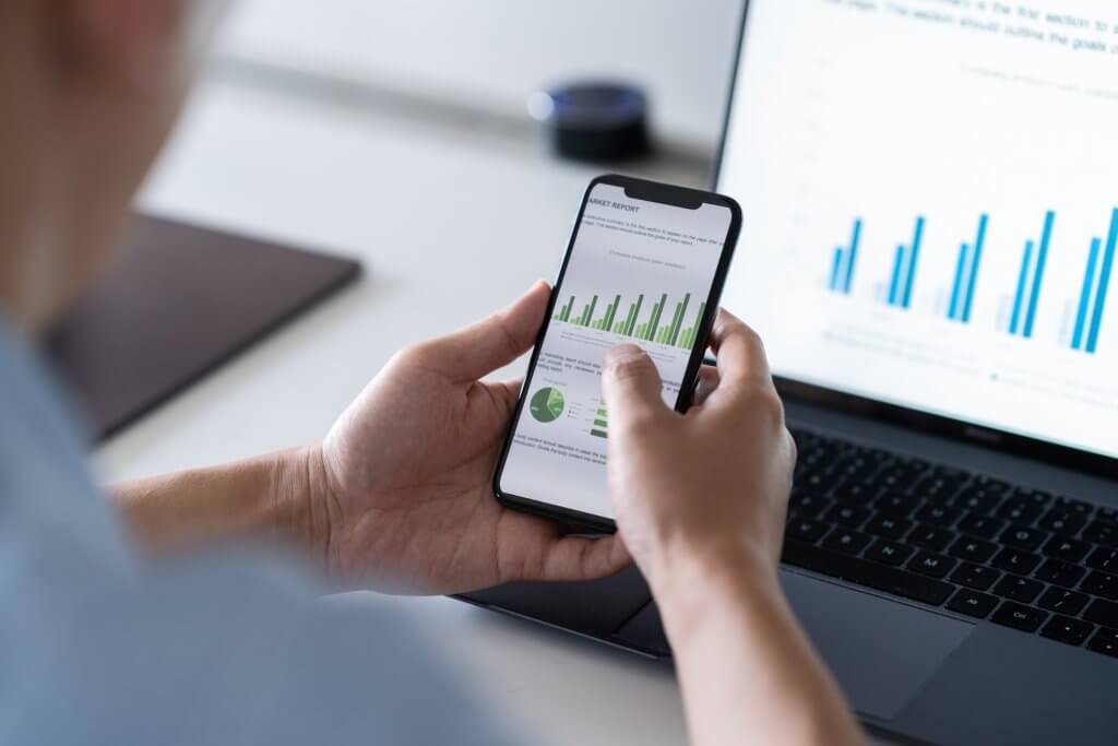 someone using a smart phone to view data visualizations
