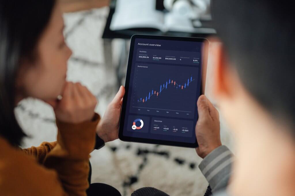 Two people analysing a set of data.